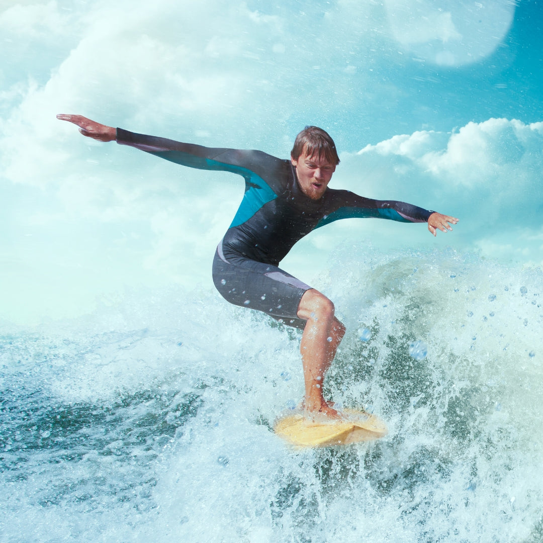 Professional surfer riding a powerful ocean wave on a surfboard